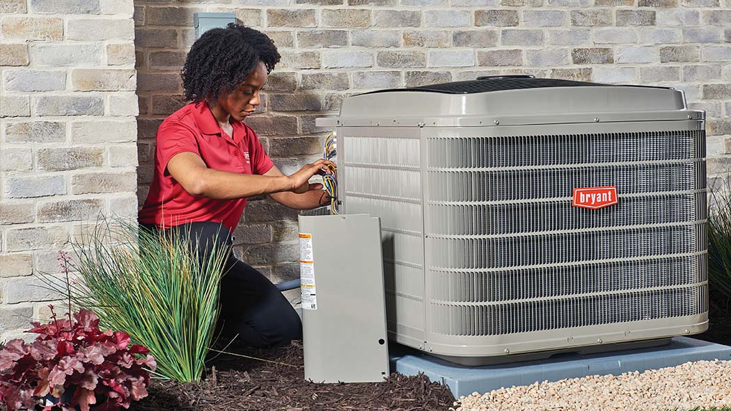A Bryant dealer performs air conditioner repair and service